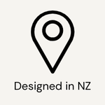 Black location pin icon with 'Designed in NZ' text on a white background