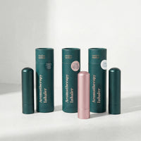 Collection of Aromatherapy Inhalers with green and pink designs on a white background