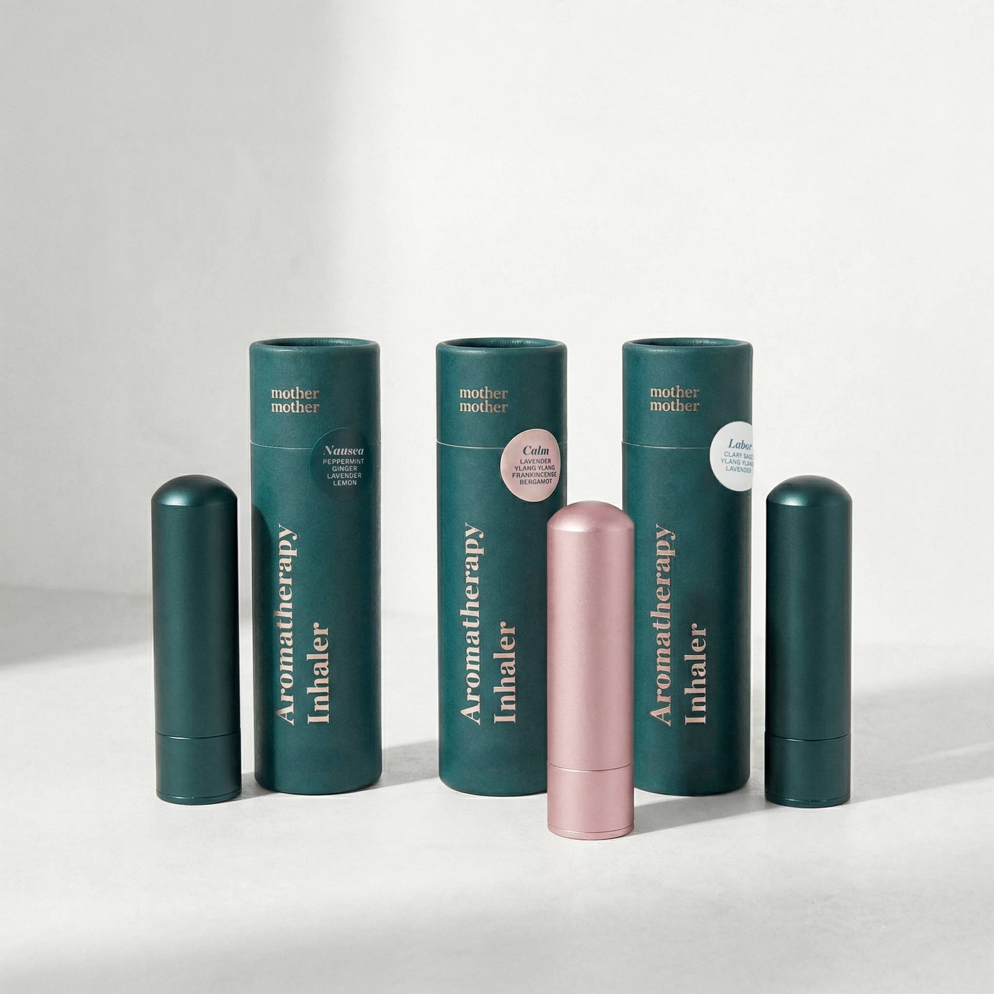 Collection of Aromatherapy Inhalers with green and pink designs on a white background