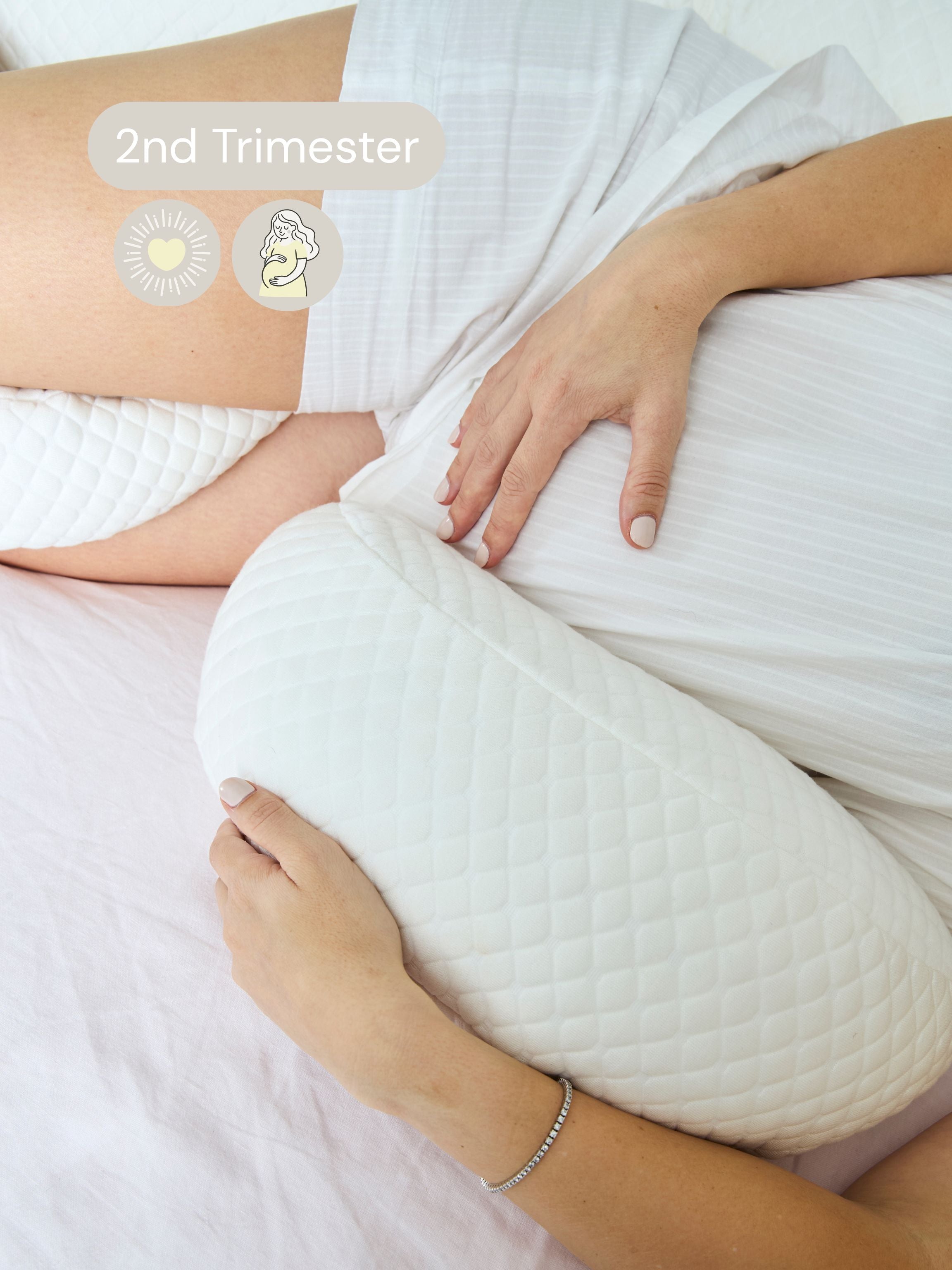 Pregnant woman using a wedge pillow during the second trimester.